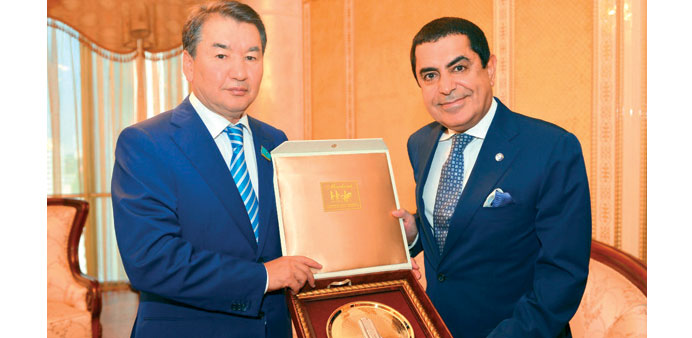  Nassir Abdulaziz al-Nasser is presented a souvenir in Astana.