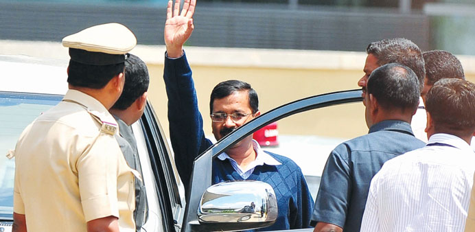 Delhi Chief Minister Arvind Kejriwal waves to supporters after arriving at the Bengaluru airport yesterday.