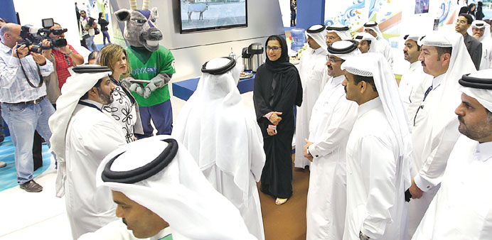HE the Minister of Energy and Industry, Dr Mohamed bin Saleh al-Sada, and other dignitaries at the ORYX GTL stand at the QP Environment Fair yesterday