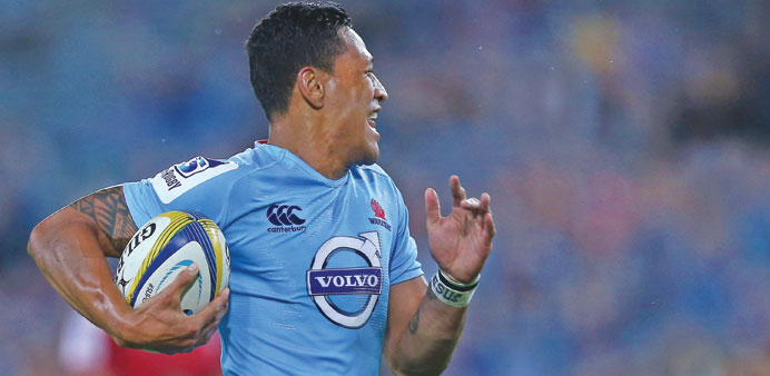 Israel Folau of the Waratahs beats the defence to score a try during the round three Super Rugby match against the Reds at ANZ Stadium in Sydney yeste