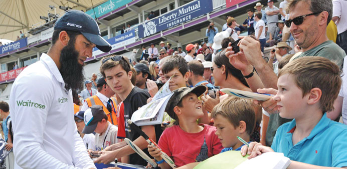 Englandu2019s Moeen Ali signs autographs after bowling England to victory in the third Test against India at The Aegeas Bowl ground in Southampton last we