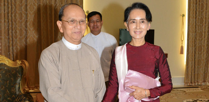 Myanmaru2019s President Thein Sein shakes hands with National League for Democracy (NLD) party leader Aung San Suu Kyi in Naypyidaw yesterday.