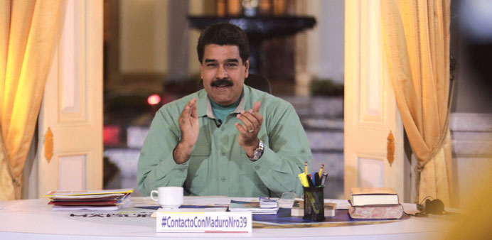 Venezuelau2019s President Nicolas Maduro applauds as he speaks during his weekly broadcast u201cIn contact with Madurou201d in Caracas.