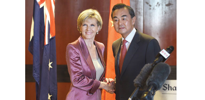 Australian Minister for Foreign Affairs Julie Bishop and Chinese Foreign Minister Wang Yi shake hands in Sydney yesterday.