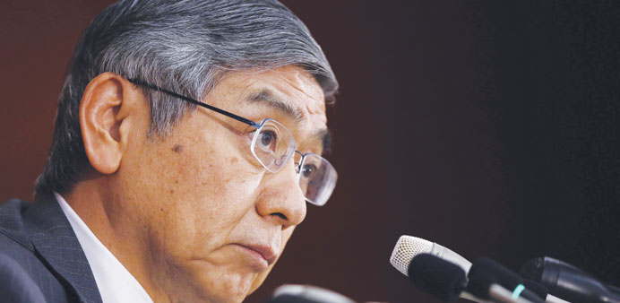 Kuroda listens to a reporteru2019s question during a news conference at the BoJ headquarters in Tokyo yesterday.