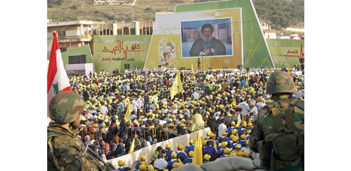  Supporters gather in Nabatiyeh yesterday to watch a televised address by Hezbollah chief Hassan Nasrallah.