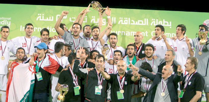  Iranian team celebrate with their trophy after winning the 11th International Friendly Under-23 Football Tournament at the Al Arabi Stadium. PICTURE: