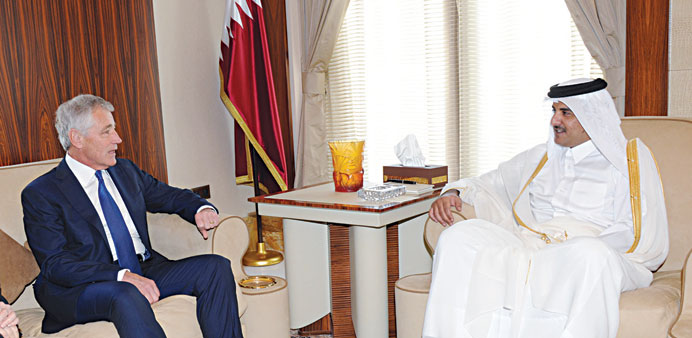 HH the Emir Sheikh Tamim bin Hamad al-Thani holding talks with US Secretary of Defence Chuck Hagel in Doha yesterday.