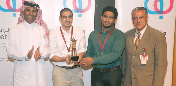 Mohamed Shaheem and Hayder Ahmed, flanked by Qatari rally champion Nasser al-Attiyah and a faculty member from WCMC-Q.