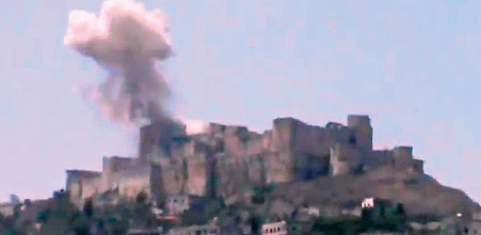 An image from a video posted online shows smoke billowing from the Krak des Chevaliers.