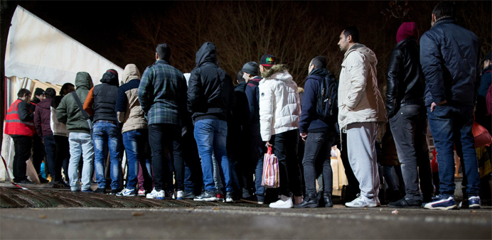 Asylum seekers line up in Berlin