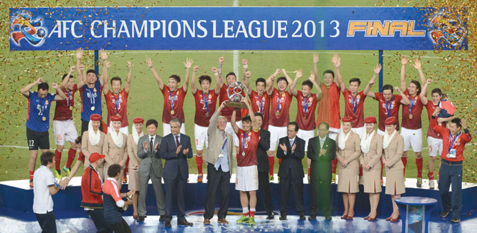 Guangzhou Evergrande celebrate their win at the AFC Champions League second leg final game against FC Seoul in Guangzhou yesterday. (AFP)