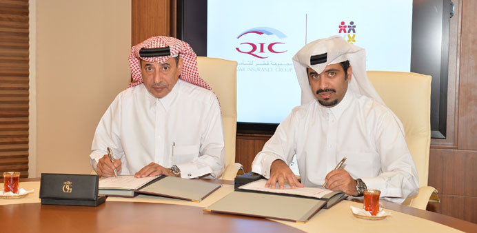 Ali al-Fadala and Fahad Hamad al-Sulaiti during the signing ceremony.