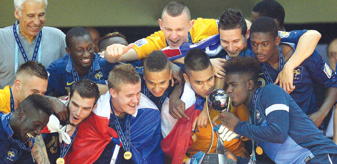French players celebrate with the trophy after the FIFA Under-20 World Cup 2013 championship final against Uruguay at the Ali Sami Yen Arena in Istanb
