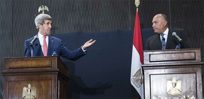 US Secretary of State John Kerry (L) gestures next to Egypt's Foreign Minister Sameh Shoukry
