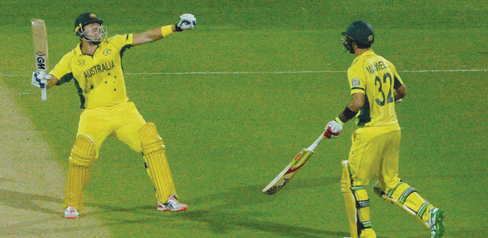 Australian batsmen Shane Watson (L) and Glenn Maxwell  celebrate after scoring the winning runs against Pakistan yesterday.