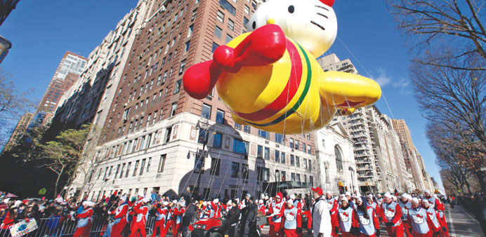The Hello Kitty balloon floats down Central Park West during the 87th Macyu2019s Thanksgiving Day Parade in New York.