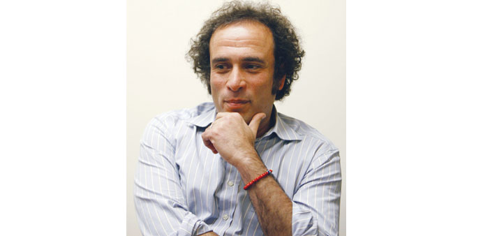 Hamzawy listens during the interview in Cairo.
