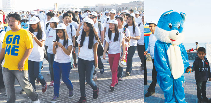 The walkathon gets underway. Right: Cartoon characters entertained children at the event.
