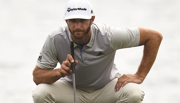 Dustin Johnson lines up a putt on the 18th green during the second round of the BMW Championship at Crooked Stick Golf Club in Carmel, Indiana. (Getty Images/AFP)