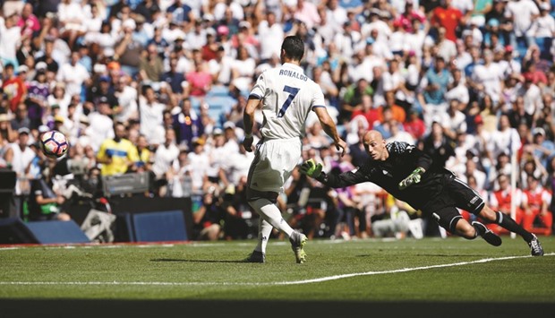 Real Madridu2019s Cristiano Ronaldo scores against Osasuna in the La Liga yesterday.