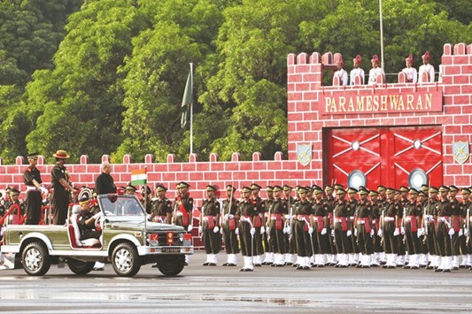 President Pranab Mukherjee reviews the honour guard at the passing out parade of the Officers Training Academy in Chennai yesterday.
