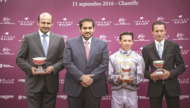 (From left) Al Shaqab Racing general manager Khalifa al-Attiyah, Qatar Racing and Equestrian Club general manager Nasser Sherida al-Kaabi, Al Mourtajezu2019s jockey Julien Auge and trainer Thomas Fourcy pose on the podium after Al Mourtajezu2019s win in the Qatar Cup u2013 Prix Dragon (Gr1 PA) at Chantilly yesterday. PICTURES: Scoopdyga