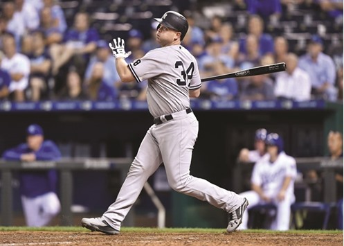New York Yankees batter Brian McCann hits a sacrifice fly to drive in the go ahead run  against the Kansas City Royals during the thirteenth inning at Kauffman Stadium. The Yankees won 5-4. PICTURE: USA TODAY Sports