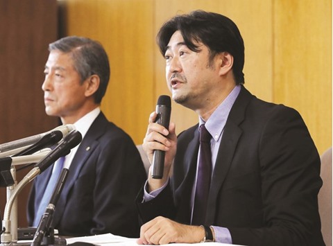 Yoshihisa Hayakawa (R), a leader of the investigation team, speaks during a press conference in Tokyo yesterday. A formal investigation found no evidence of bribery by Japanese officials after probing a $2mn payment made during Tokyou2019s successful bid to host the 2020 Olympics. (AFP)