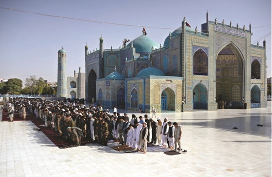 Afghans offer Eid al-Adha prayers at the Hazrat-i-Ali shrine in Mazar-i-Sharif yesterday.