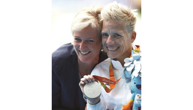 Princess Astrid of Belgium (L) poses with Marieke Vervoort of Belgium as she celebrates with her silver medal during the presentation ceremony. (Reuters)
