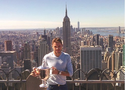 Stan Wawrinka of Switzerland poses with the 2016 US Open menu2019s Singles champions trophy in Manhattan, New York, yesterday. (Reuters)