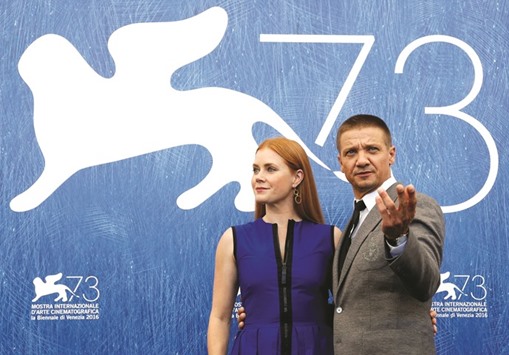 Actors Jeremy Renner and Amy Adams pose during a photocall of the movie Arrival, presented in competition at the 73rd Venice Film Festival.