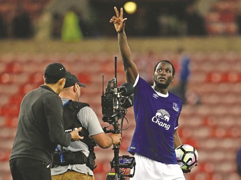Evertonu2019s Romelu Lukaku celebrates after scoring a hat trick.
