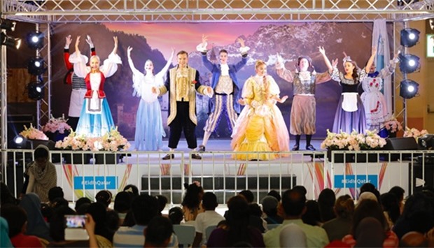 Beauty and the Beast performers sing and dance on stage