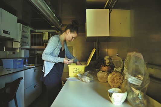 An archaeologist working on objects of antiquity at the French Archaeological Delegation to Afghanistan (DAFA) office in Kabul.