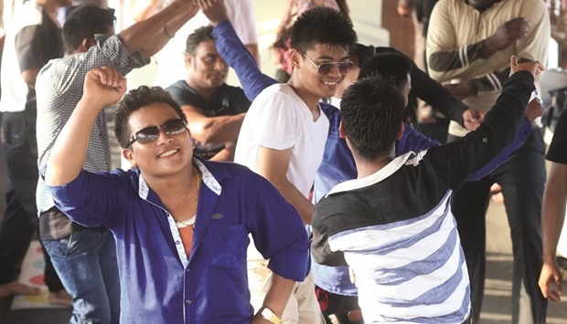 Expatriate single workers celebrate the Eid holiday with singing and dancing aboard a cruise boat off the Corniche yesterday. PICTURES: Jayan Orma