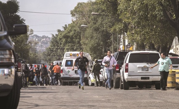 Police outside the stateu2019s general prosecutoru2019s office in Guadalajara.  A gunman shot dead one person and wounded another three at the prosecutoru2019s office before being killed by police.
