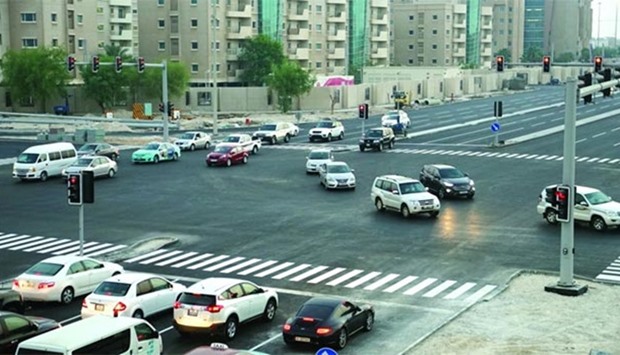 Vehicles passing through the Civil Defence intersection, which has replaced the old roundabout.