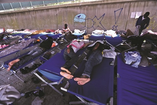 Migrants sleep on camp beds at a Red Cross centre in the city of Ventimiglia on the French-Italian border.