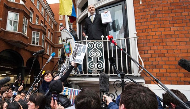 WikiLeaks founder Julian Assange (C) addressing media and supporters from the balcony of Ecuador's embassy in central London, on February 05, 2016.  AFP