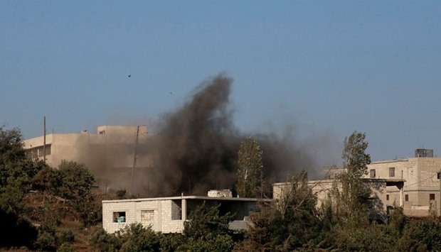 Smoke rises due to shelling on the rebel controlled town of Jubata al-Khashab, in Quneitra countryside, Syria