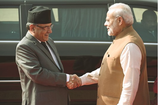 Indian Prime Minister Narendra Modi, right, shaking hands with Prime Minister of Nepal Pushpa Kamal Dahal u2018Prachandau2019 during a ceremonial reception at the Presidential Palace in New Delhi yesterday.
