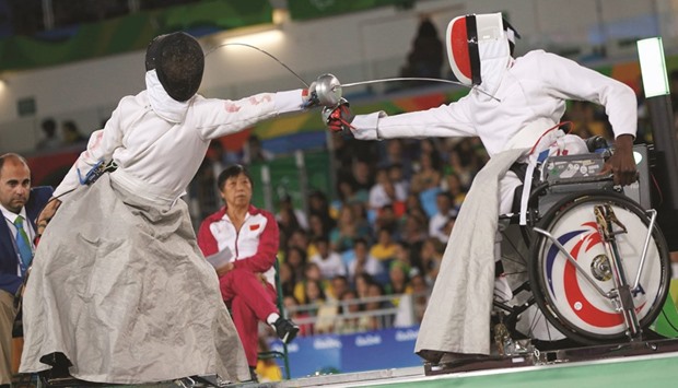Sun Gang of China and Yannick Ifebe of France compete in the 2016 Rio Paralympics  wheelchair fencing menu2019s Epee team gold medal match on Thursday. (Reuters)