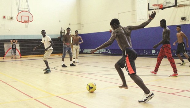 Participants play at a recent indoor practice with Soccer Without Borders, in Baltimore, Maryland, USA.