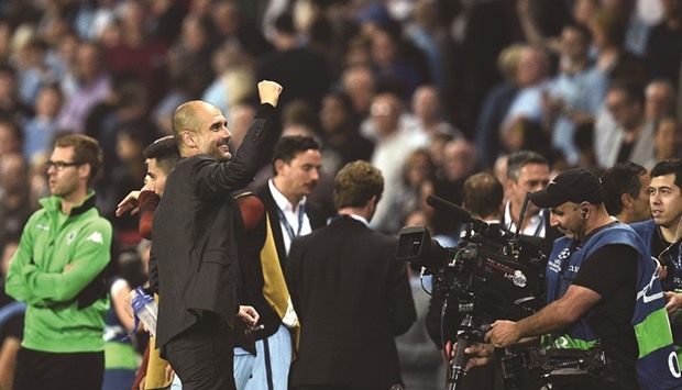 File picture of Manchester City manager Pep Guardiola waving to the crowd after his teamu2019s recent Champions League tie.
