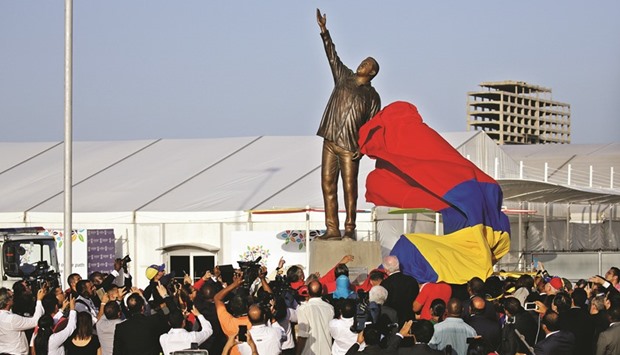 A statue of Venezuelau2019s late president Hugo Chavez is unveiled during an event at the entrance of the Venetur Hotel Convention Center, venue of the 17th Non-Aligned Summit in Porlamar, Venezuela.