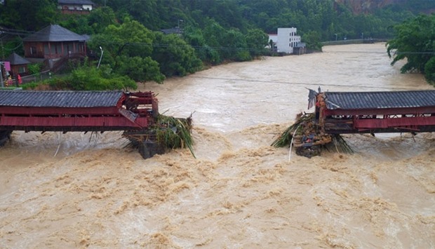 An ancient bridge is seen collapsed as typhoon Meranti hits southeast China, in Yongchun, Fujian province, China