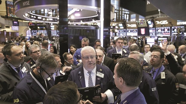 Traders work on the floor of the New York Stock Exchange. The S&P 500 closed up 0.5% to 2,139.16 points on Friday.