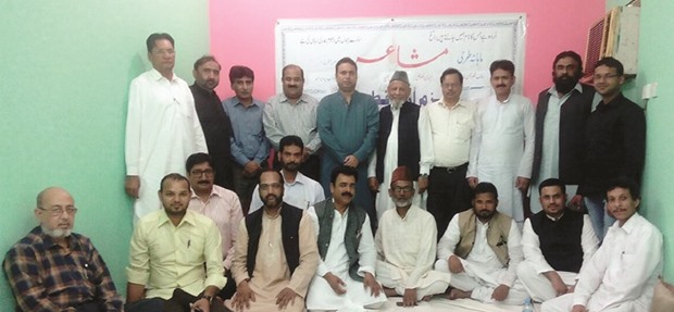 FOR THE LOVE OF URDU: Members of Bazm-e-Urdu Qatar (BUQ) pose for a group photo at the poetry symposium.